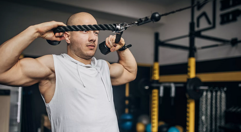 Performing face pulls with a resistance band