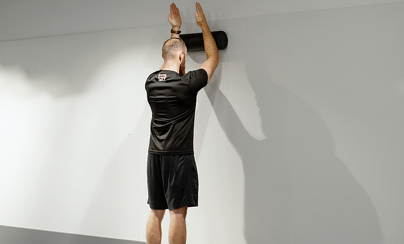 Foam Roller Wall Slide Exercise