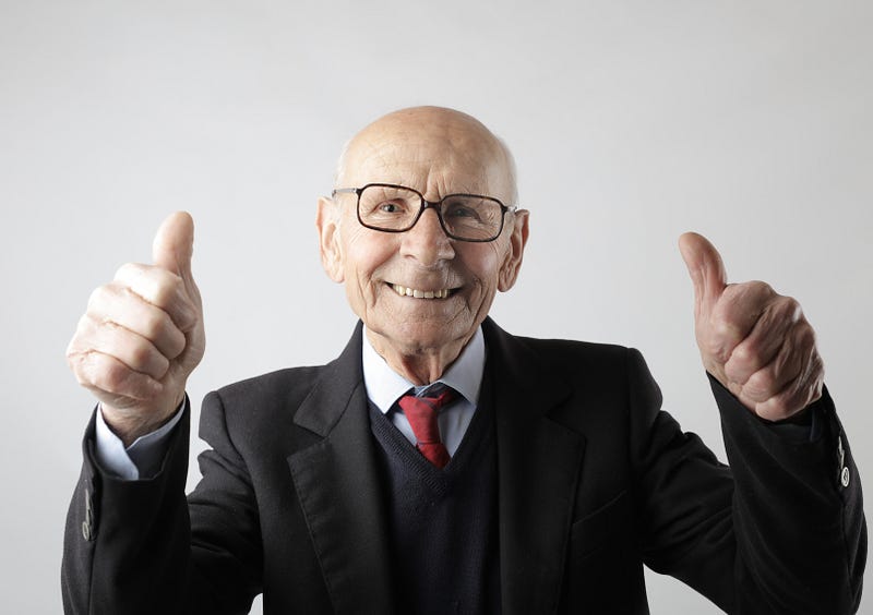 A cheerful bald person enjoying life