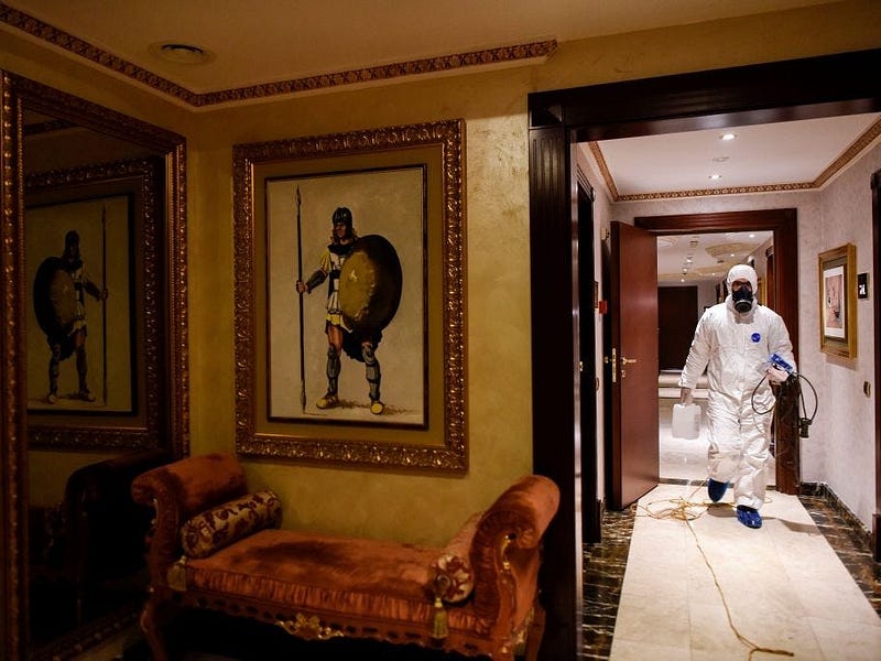 Employee cleaning a hotel room